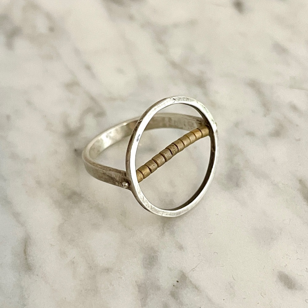 Silver circle ring with brass beads